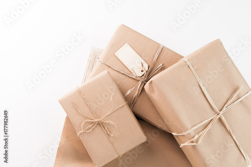 packages wrapped in brown paper and tied with twine