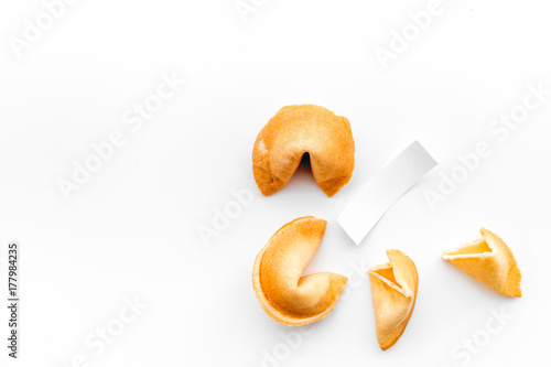 Konstfotografi Chinese fortune cookie with prediction on white background top view space for te