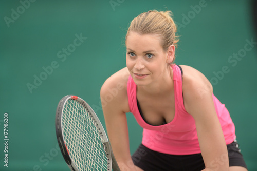 young woman with tennis racket © auremar