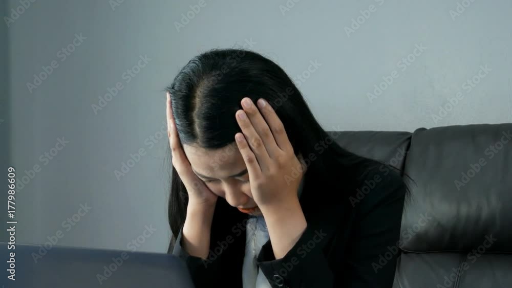 4k of tired and stressed young woman working on a computer 4k of tired and stressed young woman working on a computer