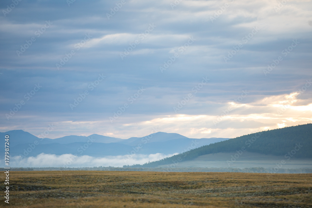 Vast foggy landscape in the northern Mongolia.