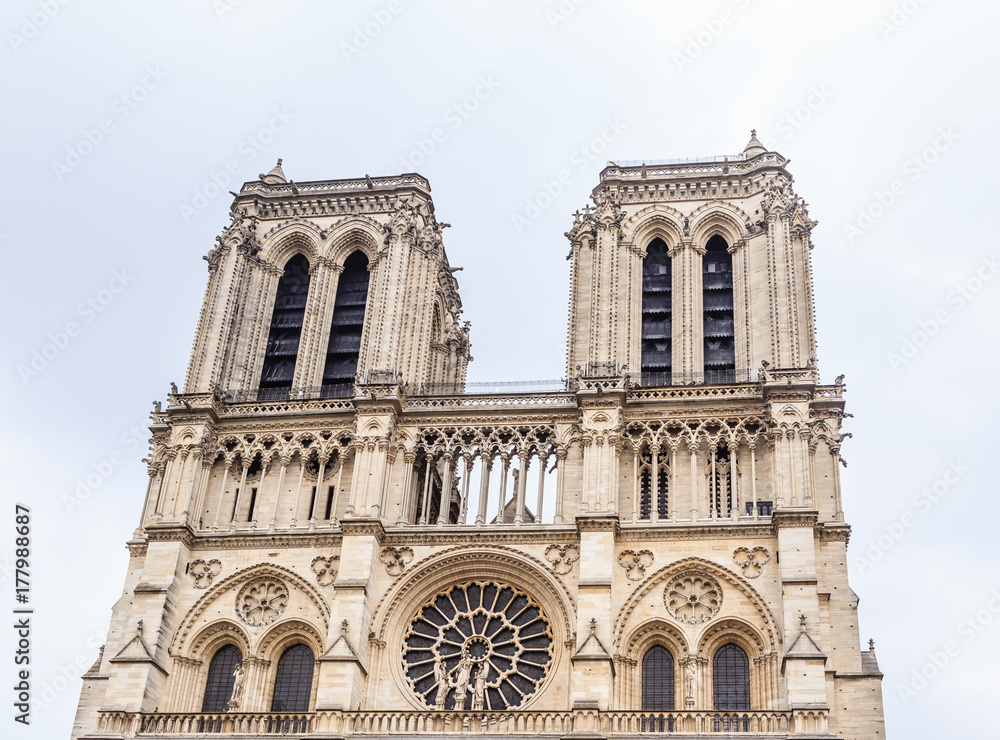 Fragmen of  facade of Notre Dame Cathedral on Cite Island. Paris, France