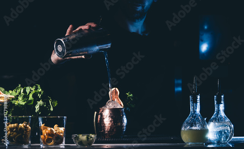 Man working at cocktail bar photo