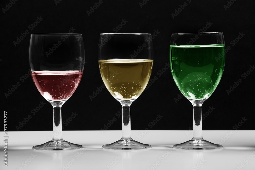 Glasses with colored water growing business chart. Glasses with colored water growing business chart.