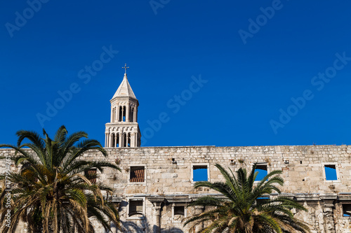 Diocletian's Palace standing above the palm trees of the Riva