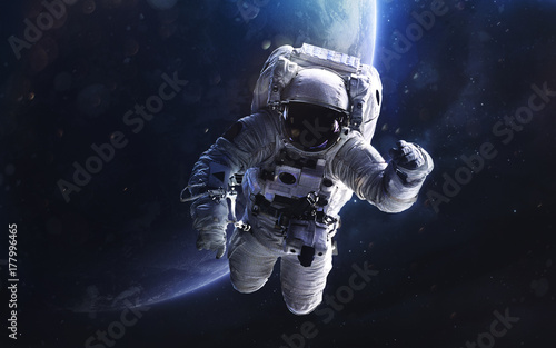 Astronaut. Deep space image, science fiction fantasy in high resolution ideal for wallpaper and print. Elements of this image furnished by NASA