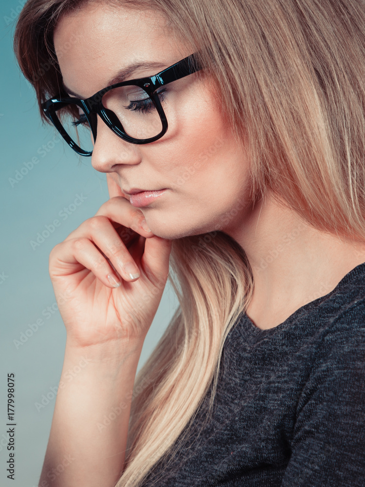 Closeup of woman thinking face expression Closeup of woman thinking face expression