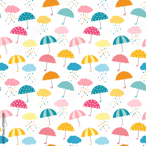 Cute and colorful vector umbrella seamless pattern with clouds and rain for kids clothing and paper products