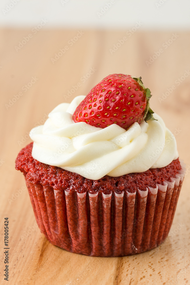 Single Red Velvet Cupcake On Wooden Table