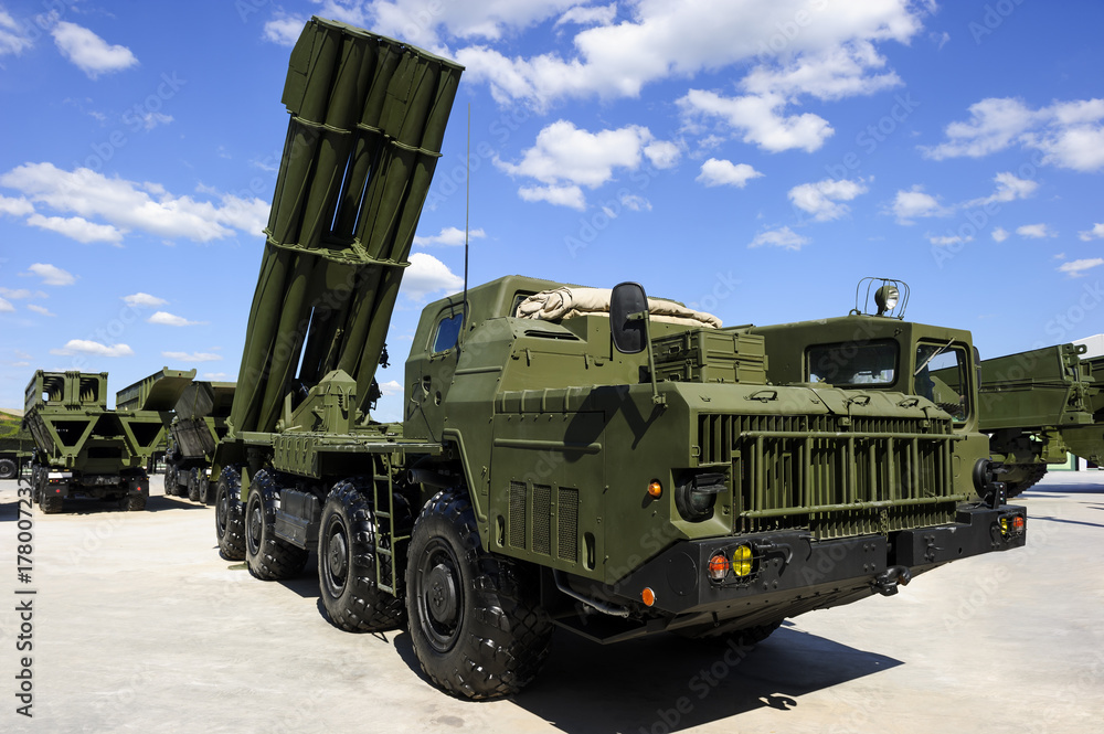 Missile launcher ready to attack on powerful heavy truck, modern military  industry, antiaircraft forces, army machines, blue sky and white clouds on  background Stock Photo