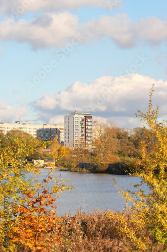 Houses on the river bank in autumn sunny weather in Riga, Latvia