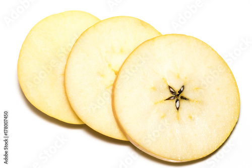 Slice of  yellow apple fruit  isolated on white background photo