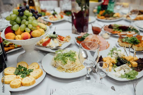 Tasty meat and vegetable snacks on the wedding table