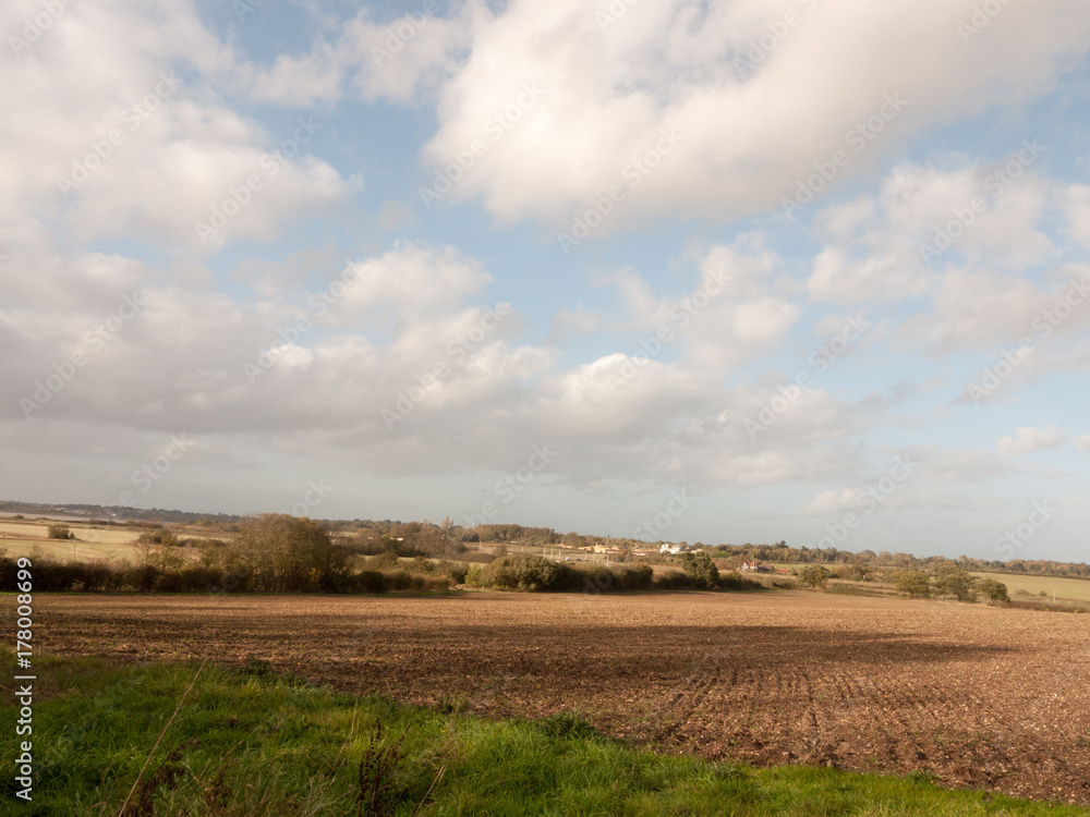 beautiful stretch of farm field landscape outside summer turning to autumn clear brown ploughed beautiful stretch of farm field landscape outside summer turning to autumn clear brown ploughed