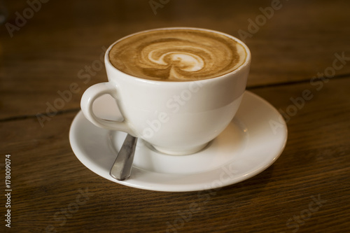 A cup of coffee over a table