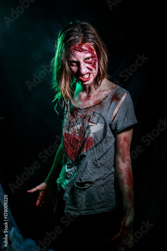 portrait of horrible zombie woman with wounds. Horror. Halloween poster.