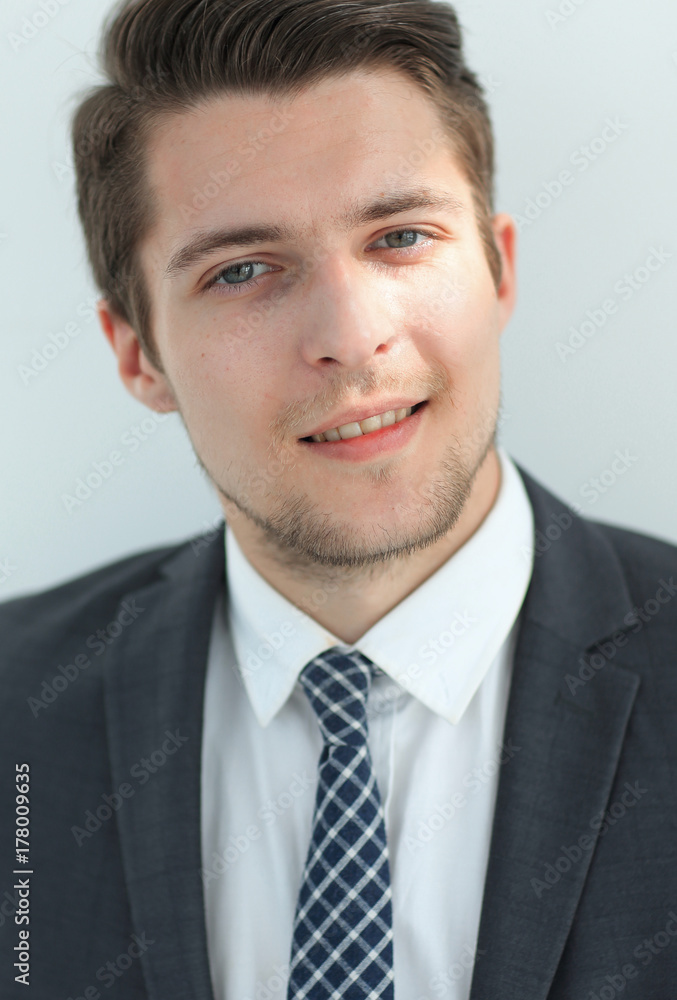 closeup.the face of a successful young man closeup.the face of a successful young man