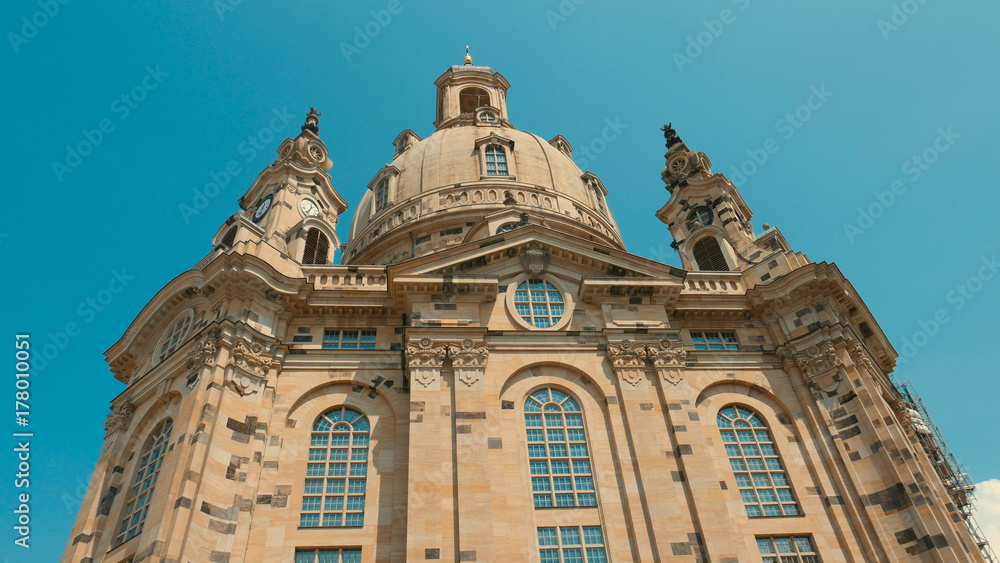 Frauenkirche Dresden - Baroque church with a characteristic dome on the background of the blue sky. Rebuilt from ruins after the destruction of the war.