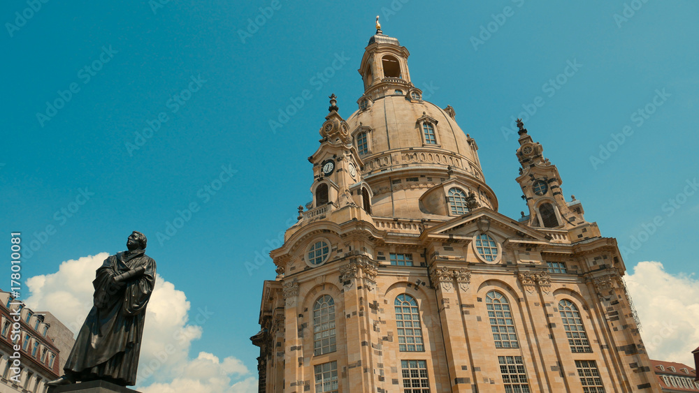 Frauenkirche Dresden - Baroque church with a characteristic dome on the background of the blue sky. Rebuilt from ruins after the destruction of the war.