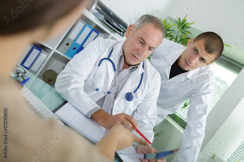 doctor looking at a patients medical history