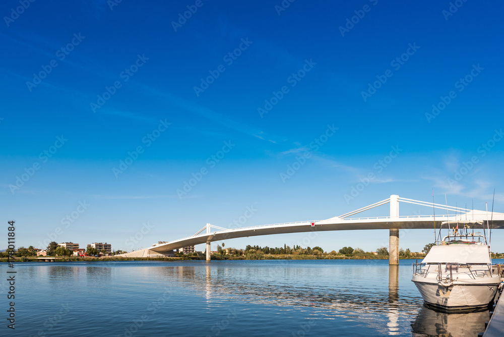 Sant Jaume d'Enveja new bridge 'Lo Passador' over Ebro river Ebro Delta, Tarragona, Catalonia, Spain. Copy space for text.