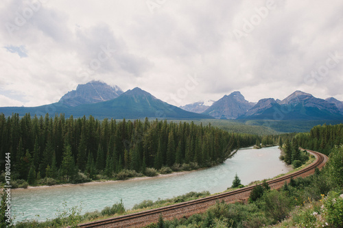 The transcanada railway along Johnston River in Banff National Park photo