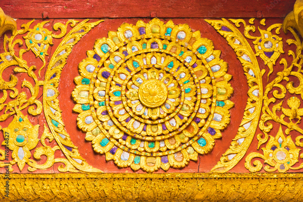 The bas-relief on the wall of the temple in Louangphabang, Laos. Close-up.