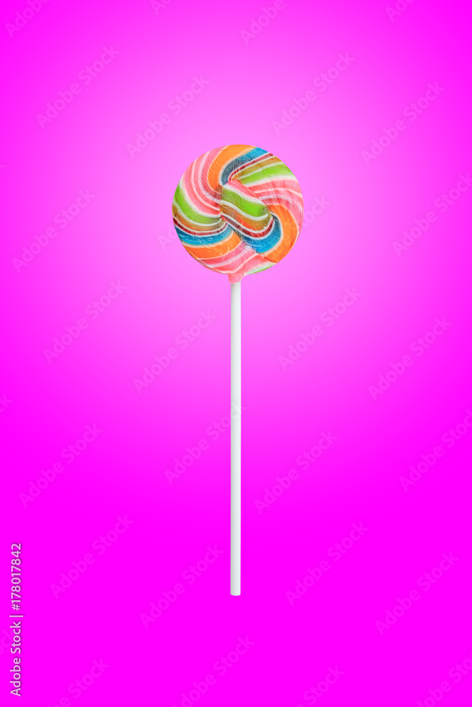 Rainbow color lollipops on pink background. Rainbow color lollipops on pink background.