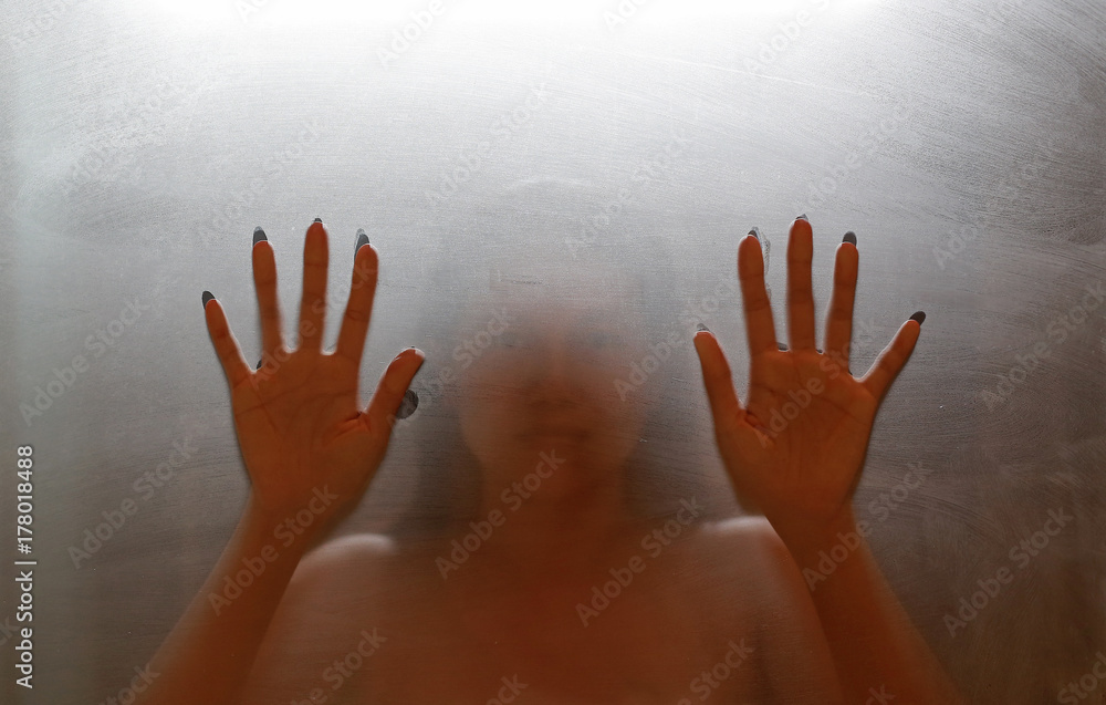 Horror woman hands. Diffused silhouette.