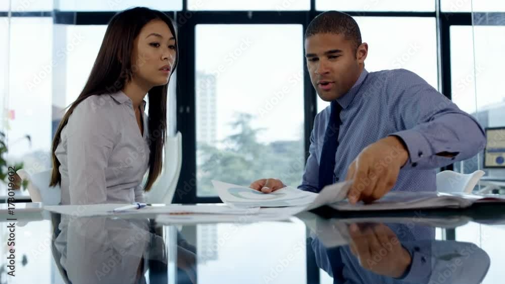 Business man & woman having an argument in office meeting Business man & woman having an argument in office meeting