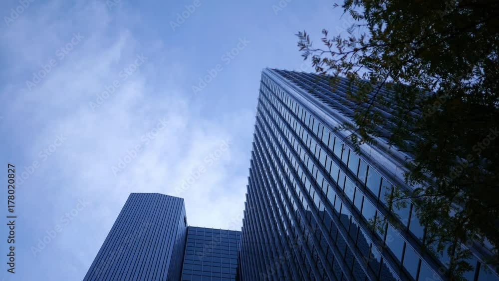 Ominous cinematic blue skyscrapers in downtown business district on dark day Ominous cinematic blue skyscrapers in downtown business district on dark day