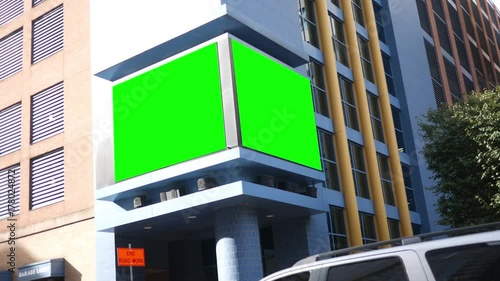 Green screen electronic billboard on city building for generic content photo