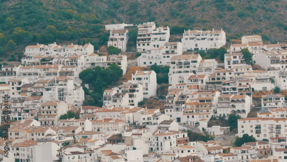 Many white houses are high in the mountains,panoramic view,Stunning beauty of the white villages of Andalusia in Spain. Many white houses are high in the mountains,panoramic view,Stunning beauty of the white villages of Andalusia in Spain.