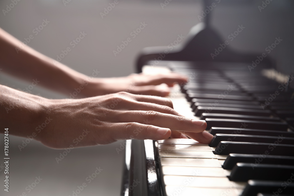 Fototapeta premium Talented woman playing piano