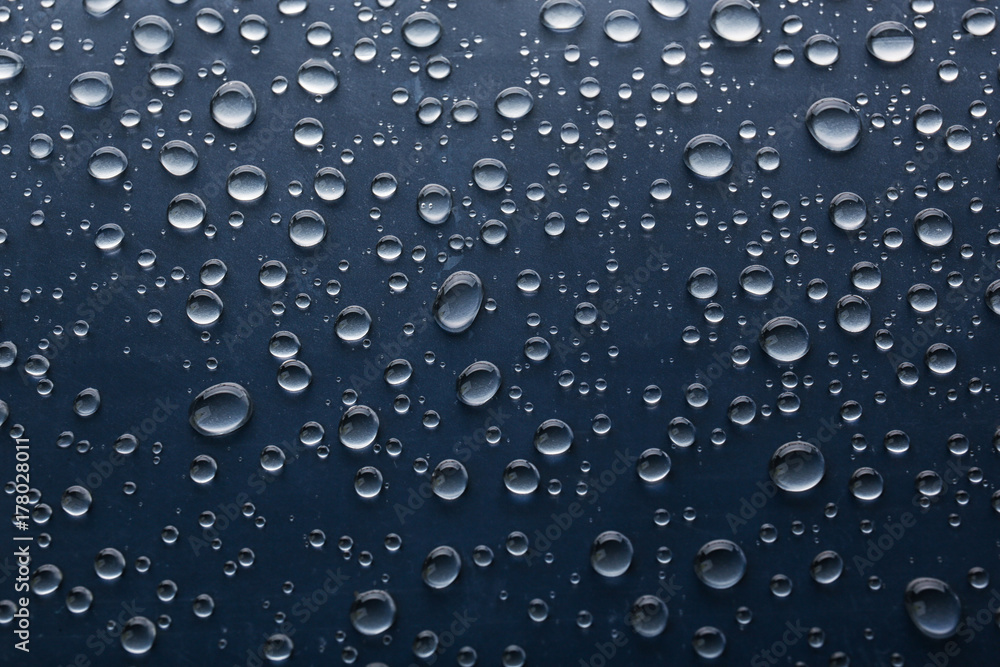 Water drops on glass, closeup Water drops on glass, closeup