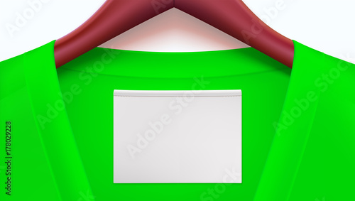 Horizontal template for advertising of sales or new arrivals. Green clothes and empty tag on the collar, wooden clothes hangers. Place for your text on white tag on t-shirt.