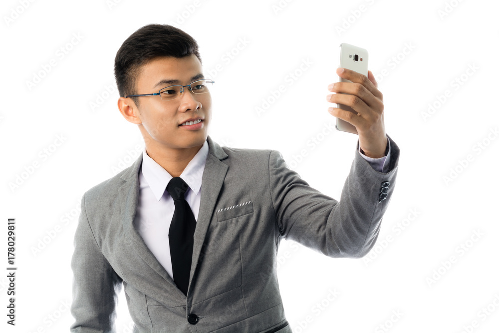Portrait of a business man with glasses and smart phone. Isolated on white background Portrait of a business man with glasses and smart phone. Isolated on white background