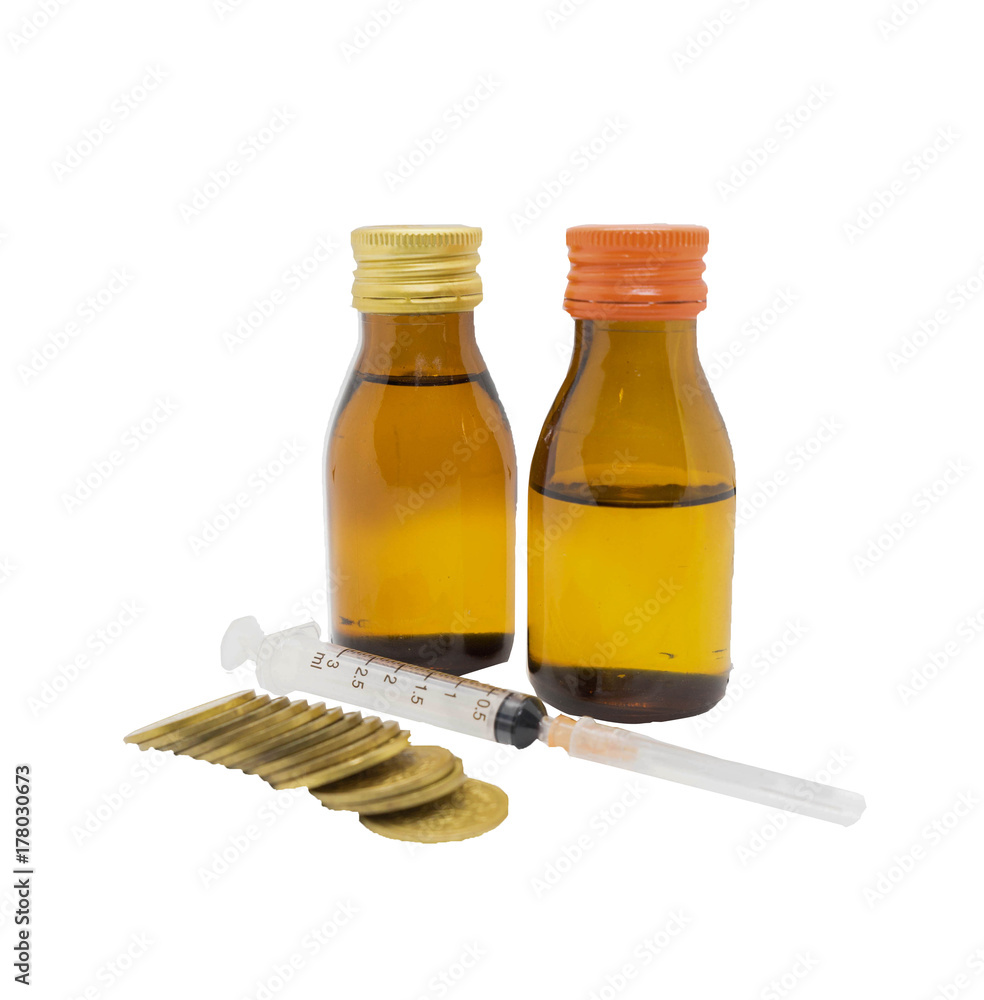 syringe drug opaque glass bottles and stack of coin in budget cost money concept spend to health with clipping path on isolated white background syringe drug opaque glass bottles and stack of coin in budget cost money concept spend to health with clipping path on isolated white background