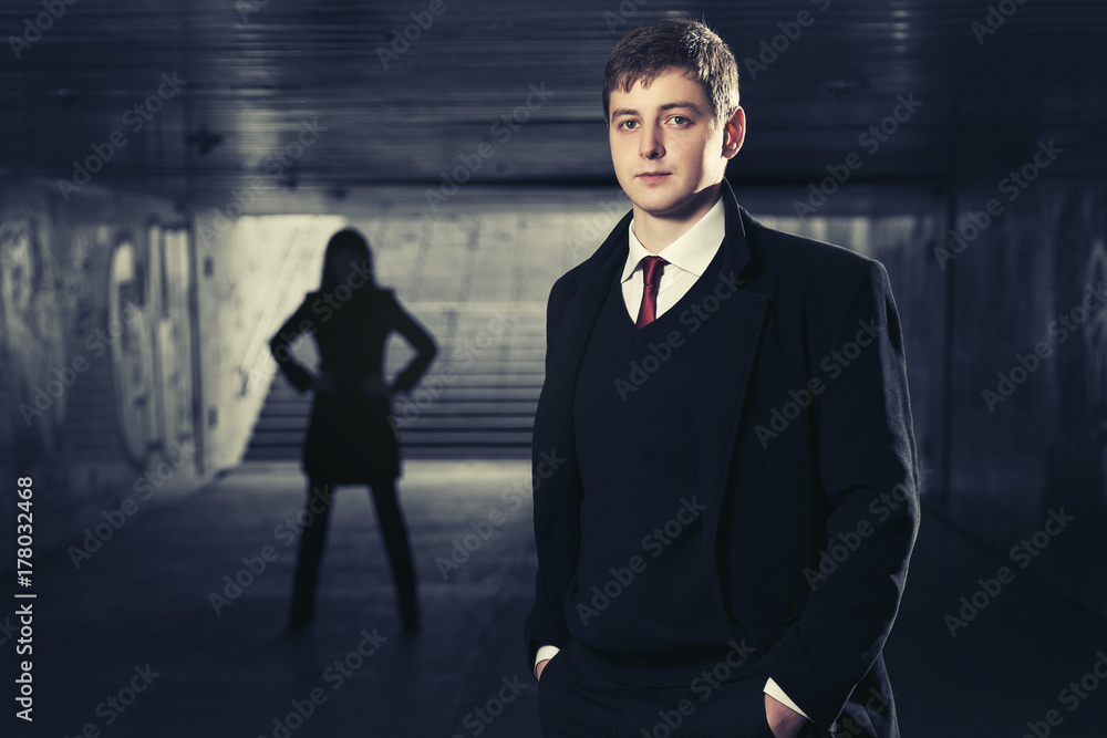 Fototapeta premium Young handsome businessman in underground tunnel