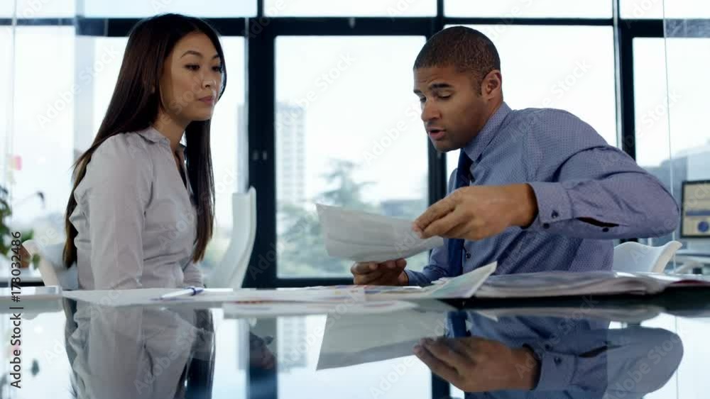 Business man & woman having an argument in office meeting Business man & woman having an argument in office meeting