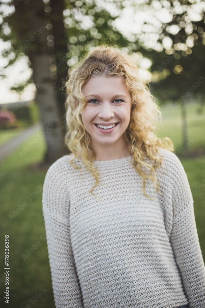Pretty teenage girl being serious outside in nature - portrait Pretty teenage girl being serious outside in nature - portrait