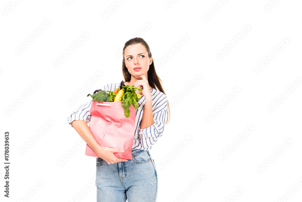 woman holding shopping bag with food woman holding shopping bag with food