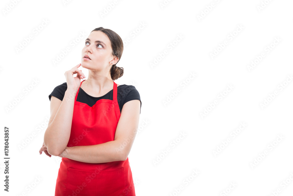 Pretty female merchandiser thinking at something Pretty female merchandiser thinking at something