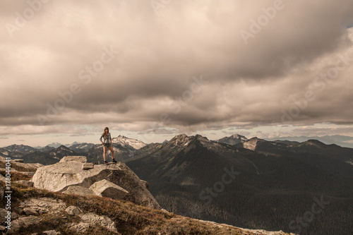 Female Hiker Posing at Summit