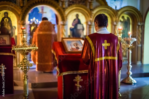 Quadro em tela Praying priest, the priest of the Orthodox Church says a prayer at the altar, st