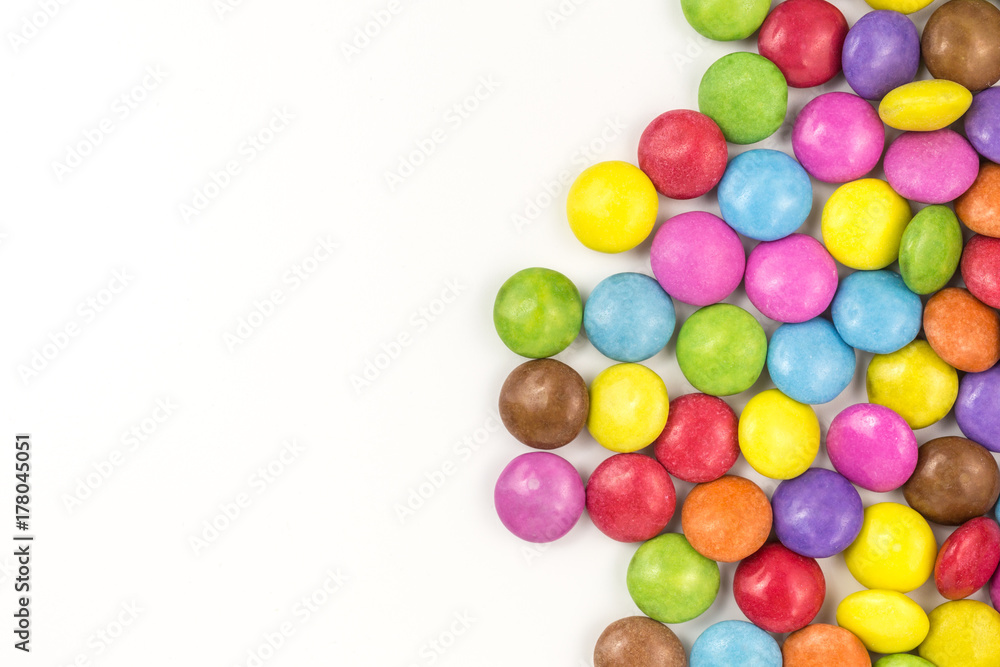 background of multicolored sugar coated candies with copyspace background of multicolored sugar coated candies with copyspace