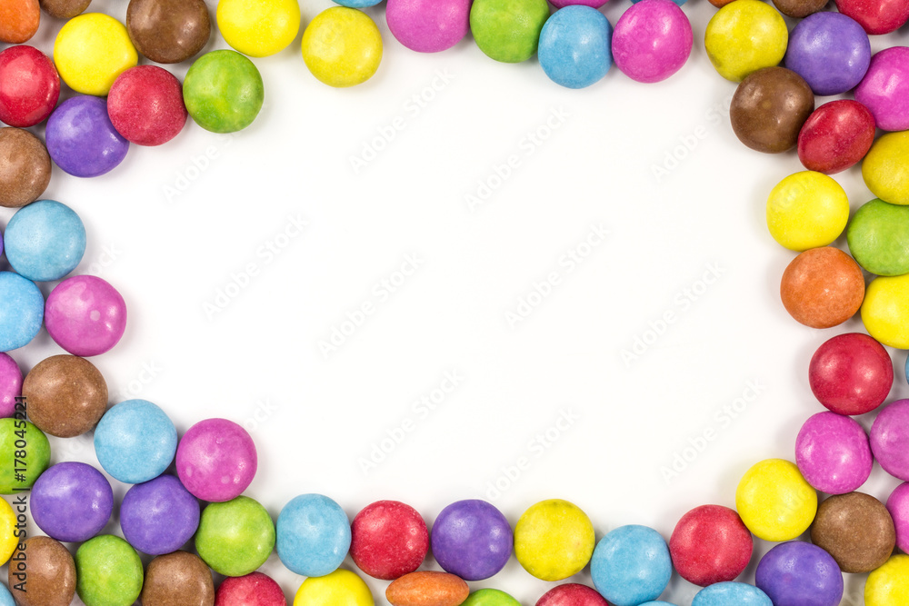 background of multicolored sugar coated candies with copyspace background of multicolored sugar coated candies with copyspace
