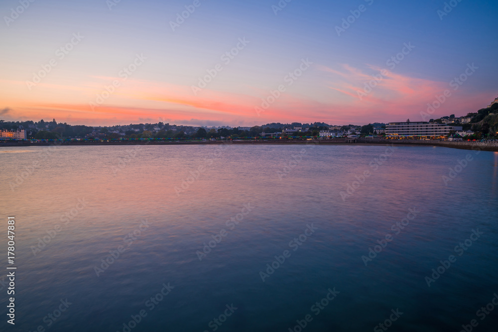 Colorful sunset over the Tor Bay, Torquay, Devon, UK