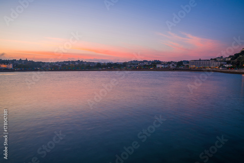 Colorful sunset over the Tor Bay, Torquay, Devon, UK
