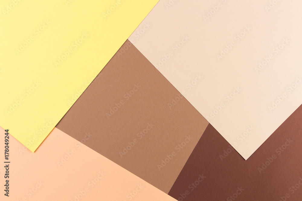 Color papers geometry composition background with yellow pink, beige and brown tones. Color papers geometry composition background with yellow pink, beige and brown tones.